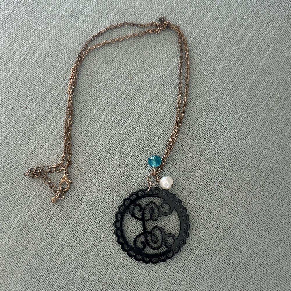 Uncommon James Gold Necklace with Black Pendant